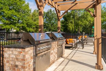 Outdoor Grill Area With Pergola